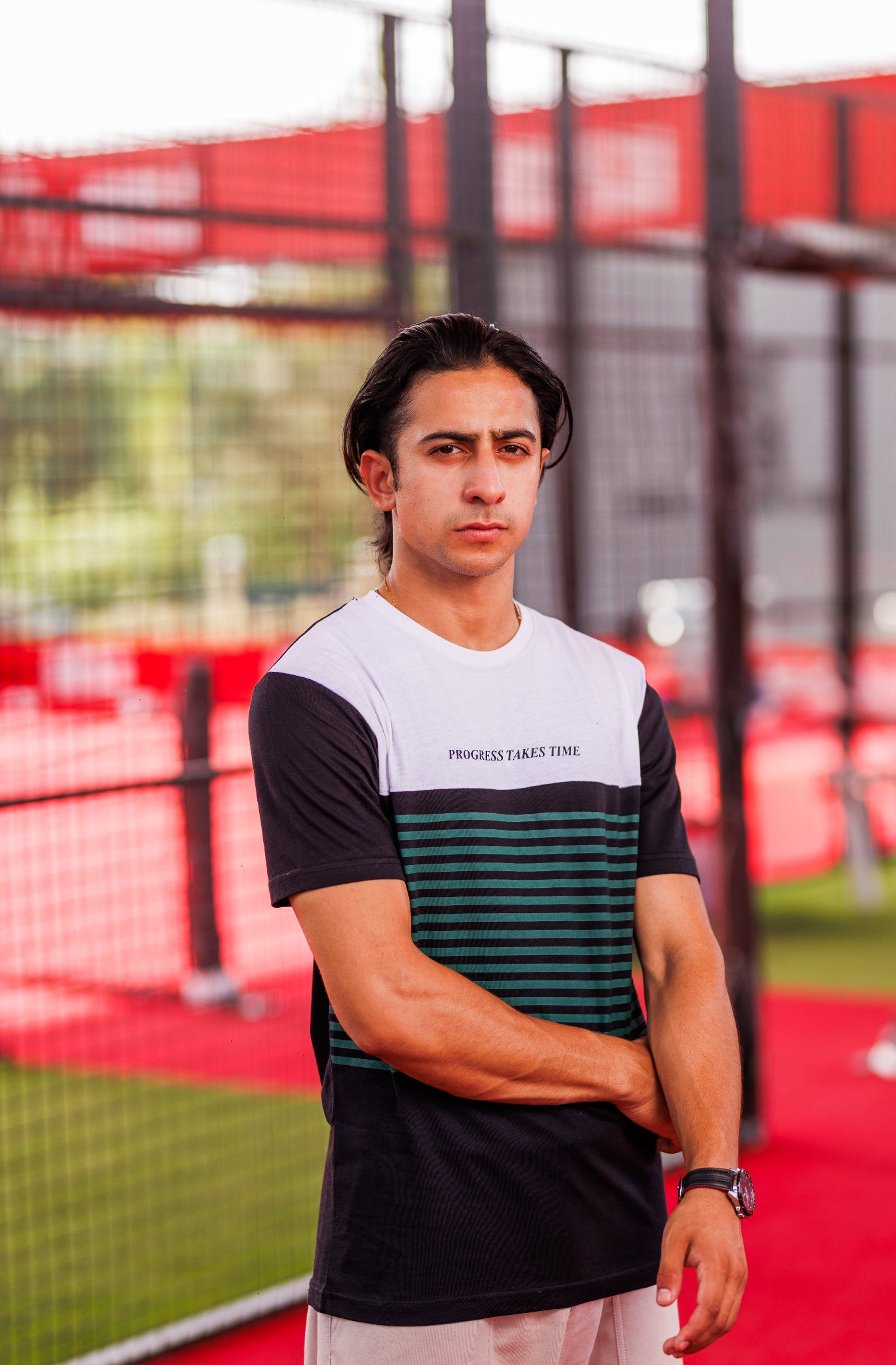 Person wearing a sports outfit on a tennis court