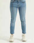 A pair of light blue skinny fit denim jeans with front and back pockets, a zipper fly, and metallic button.