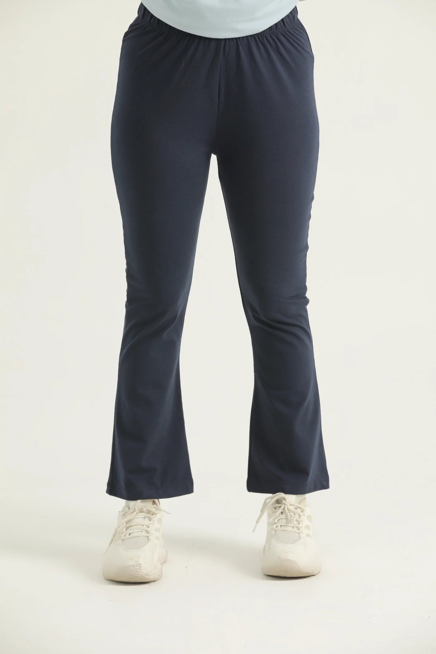A pair of navy flared leggings with a high waistband, displayed against a white background.