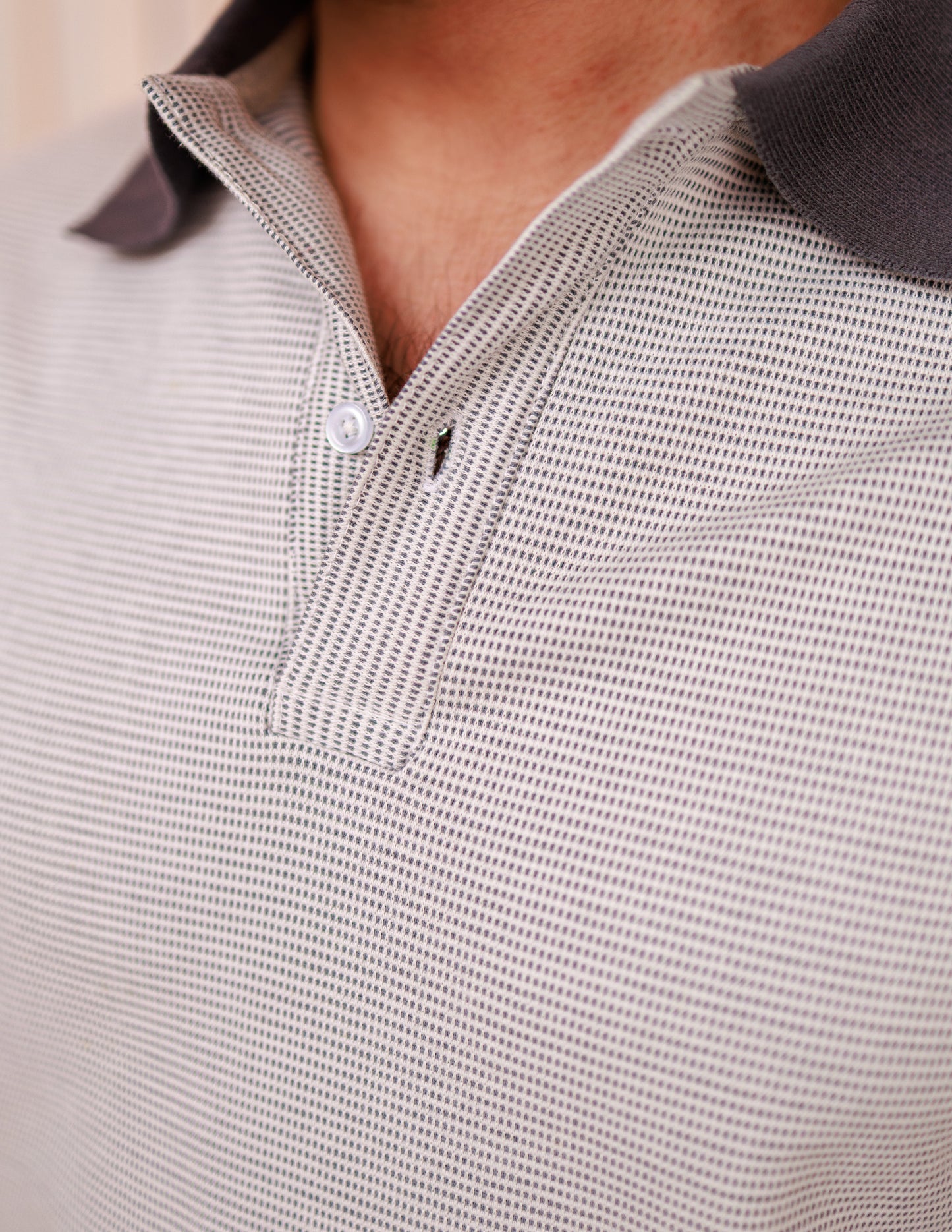 Close-up of a textured polo shirt with a collar detail.