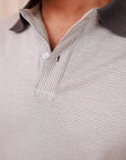 Close-up of a textured polo shirt with a collar detail.
