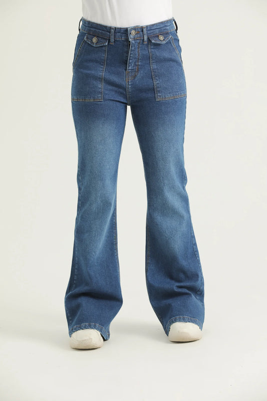 A pair of medium blue bootcut denim jeans with scope pockets, fly with zipper and metallic button.