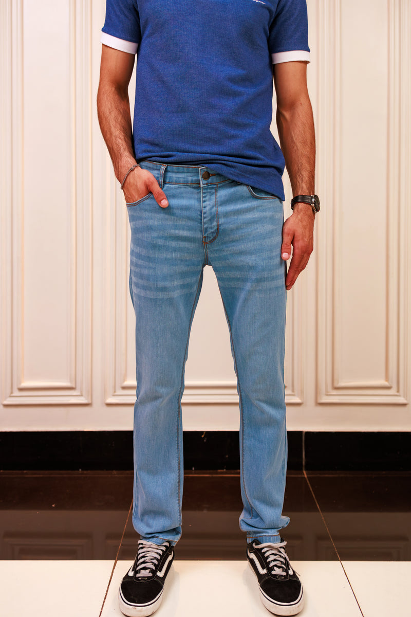 Light blue jeans worn by a person on a white background