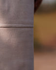 Close-up of a brown leather surface with a blurred background