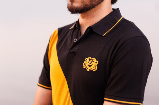 Black and yellow polo shirt with a logo on a plain background