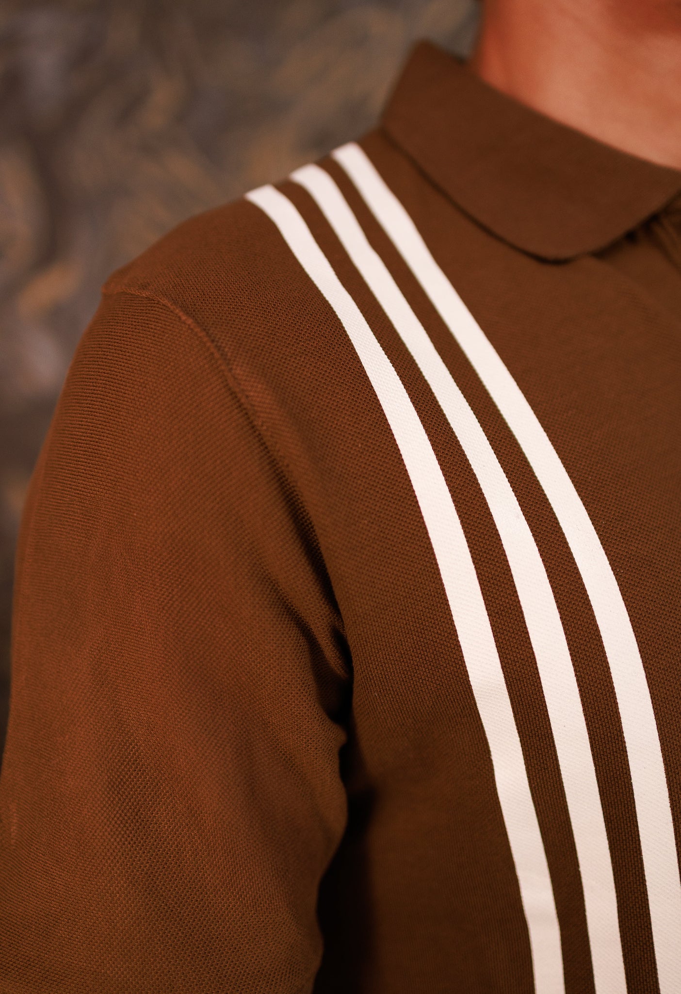 Brown shirt with white stripes on a blurred background