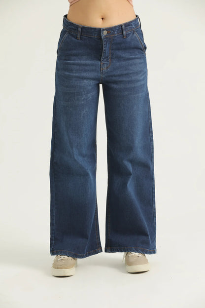 A pair of blue flared denim jeans with cross pockets, fly with zipper, and metallic button.