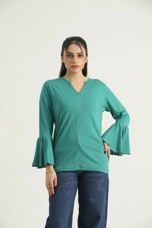 A woman wearing a turquoise green top with a round neckline and long flared sleeves. The top is a knit fabric and the image shows the top in a vertical orientation.